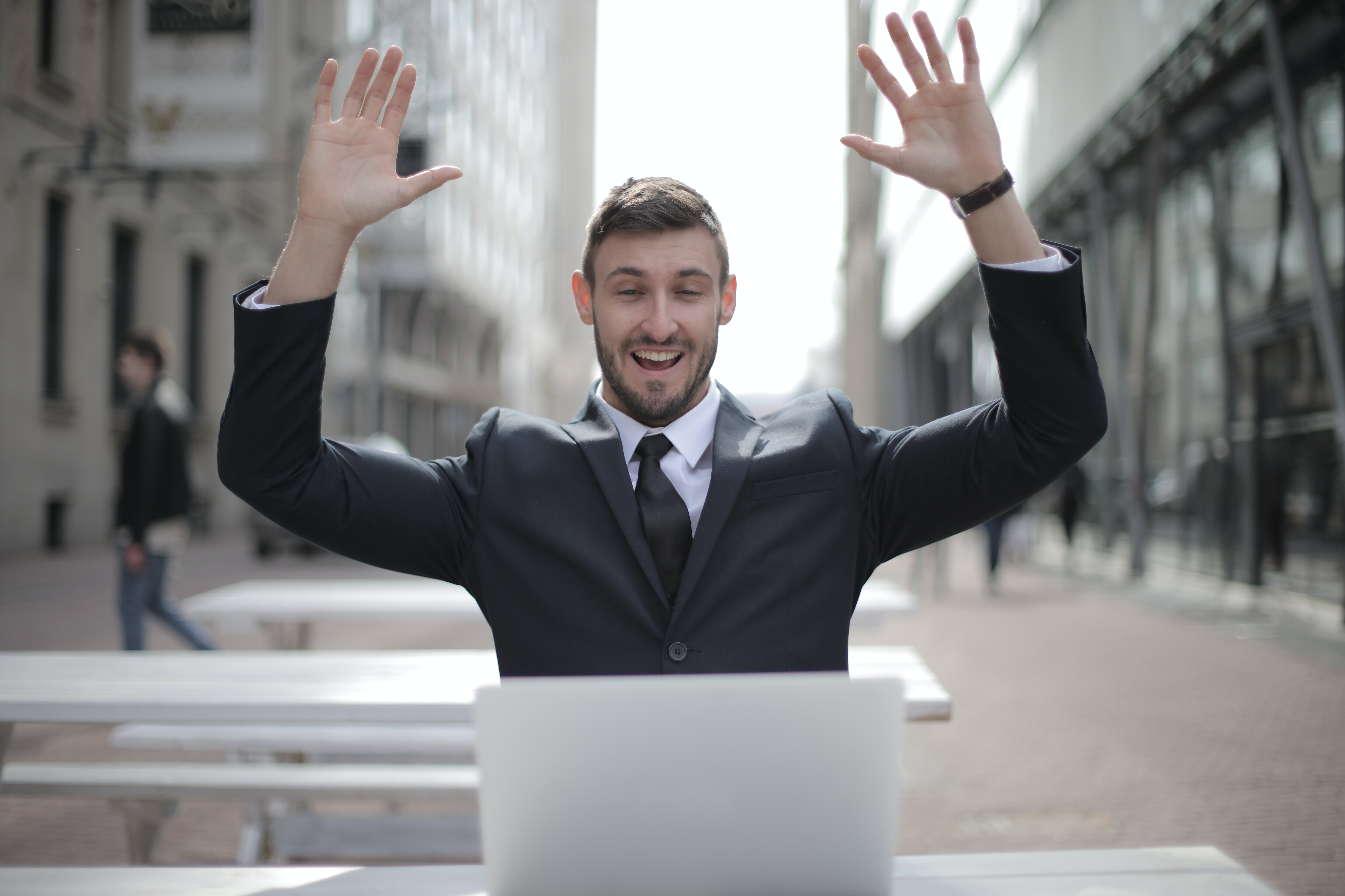 Use Debt Management to Get Rich Use debt management strategies to get rich, like this happy man looking at his computer